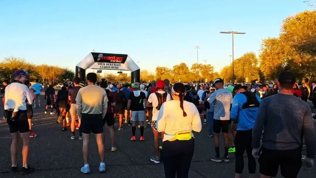 Pre-race supplies and runners lining up