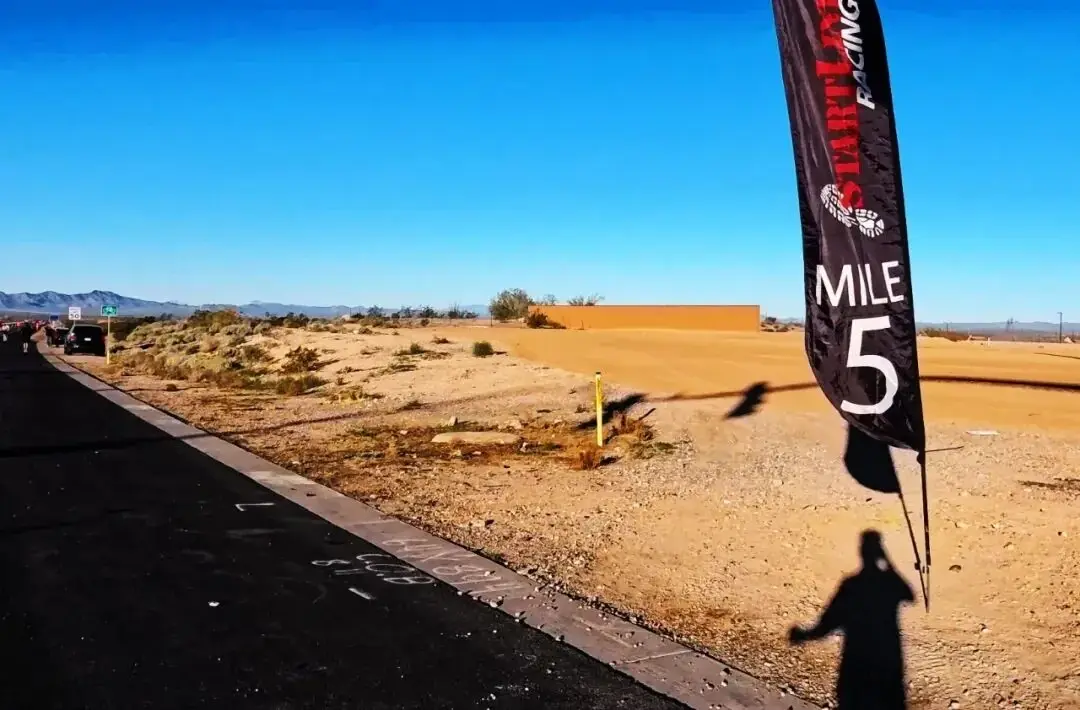 Runners and mountains at the end of the road