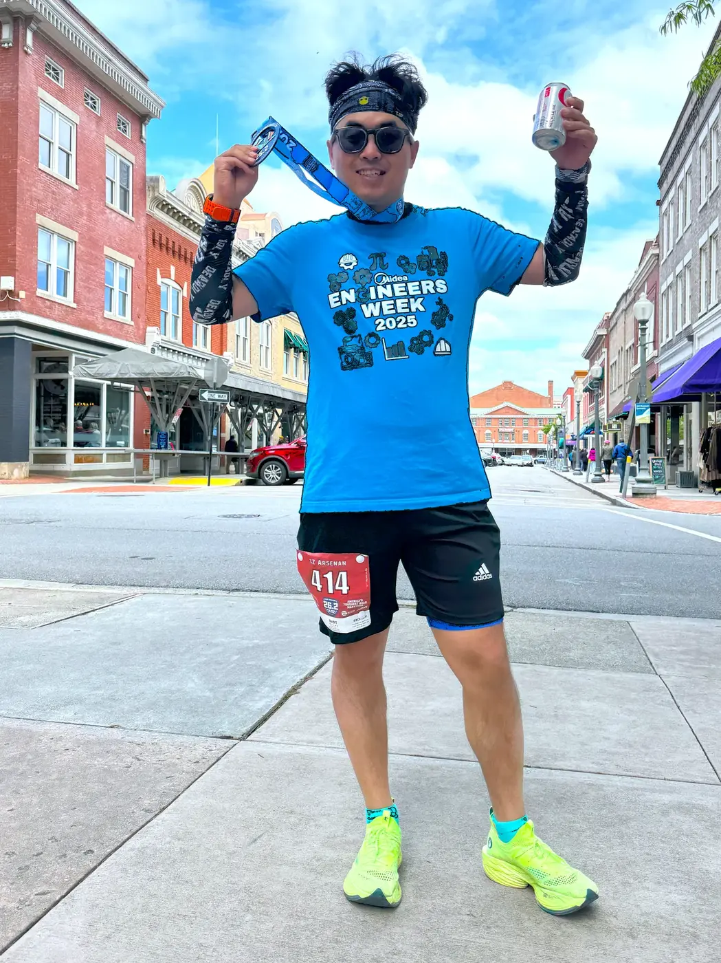 Medal pose on a sunny downtown corner