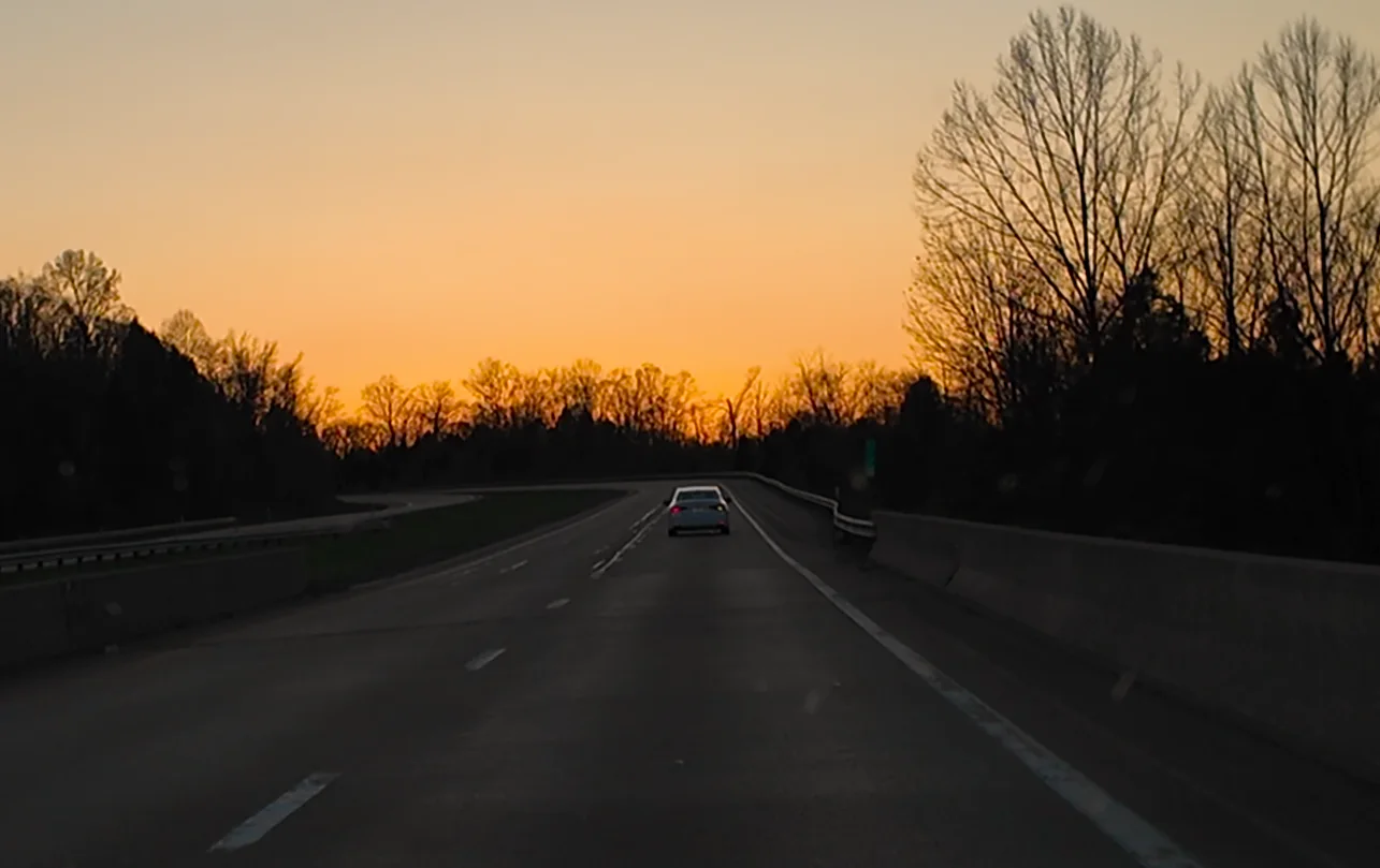 Sunset road after the mountain weekend