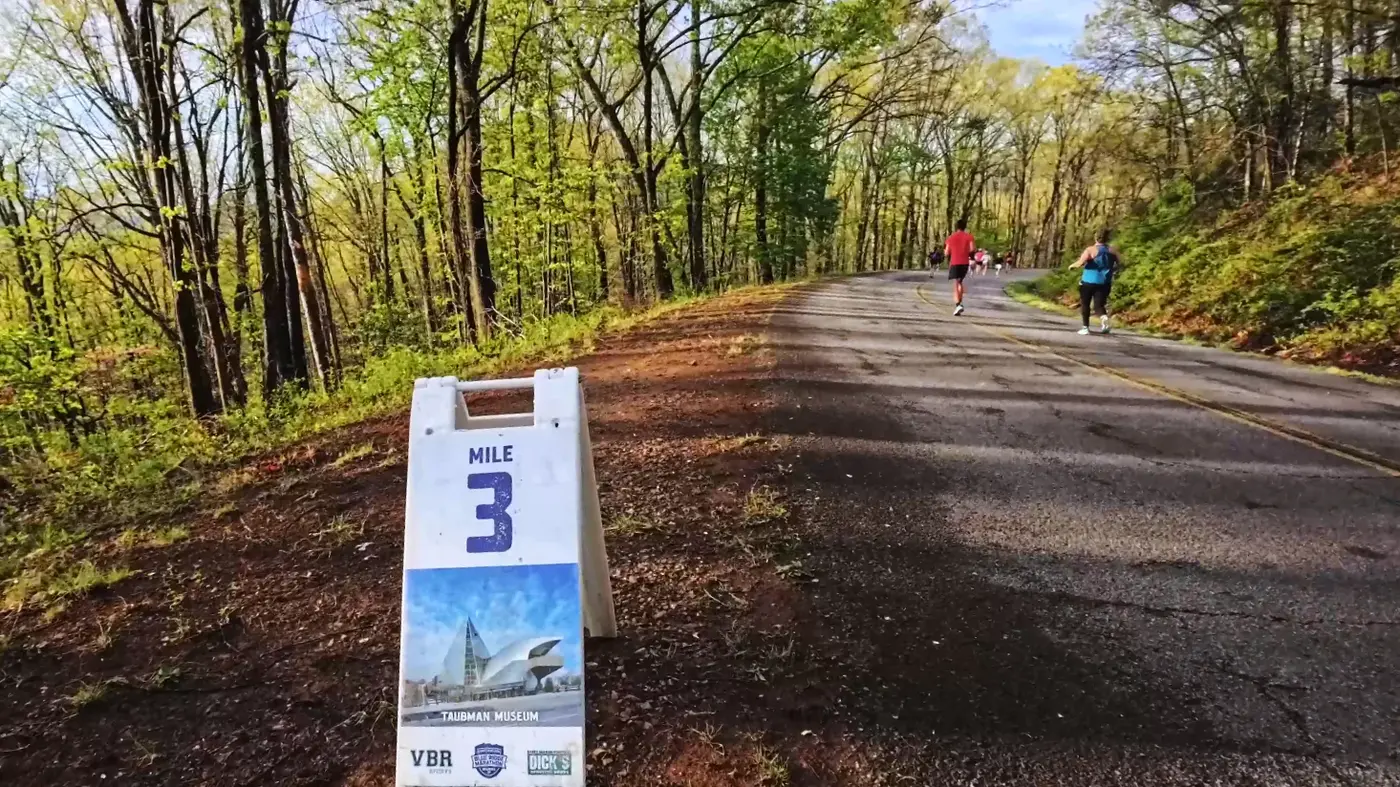 Mile 3 marker on the shaded climb