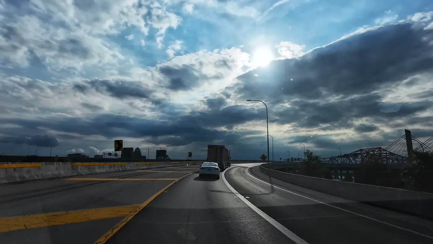 Storm clouds opening over the road north
