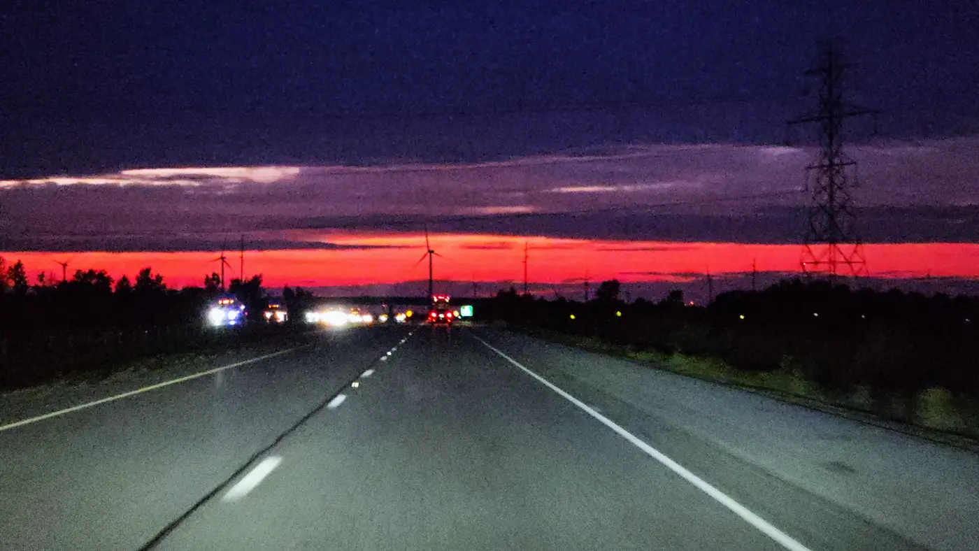 Red sunset stripe on the interstate