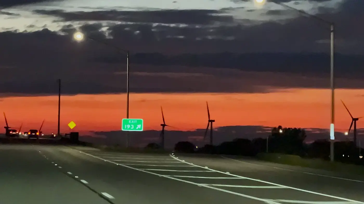 Exit sign under a North Dakota sunset