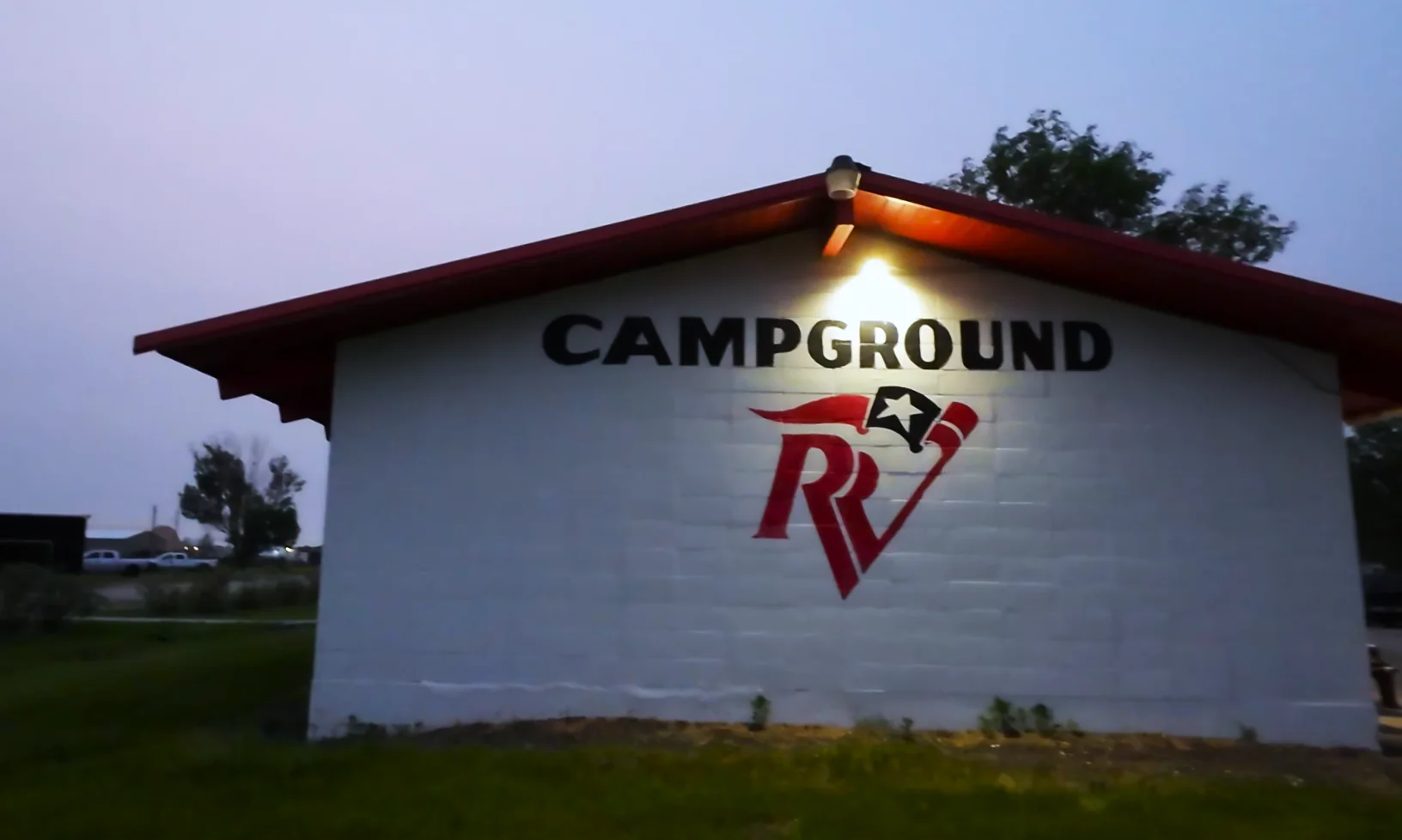 Campground sign at dusk
