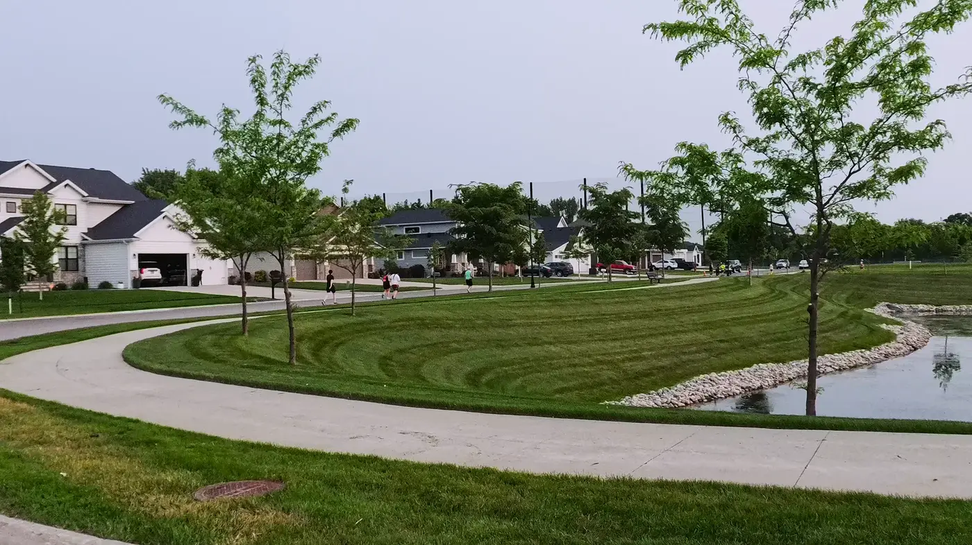 Curving sidewalk beside new houses