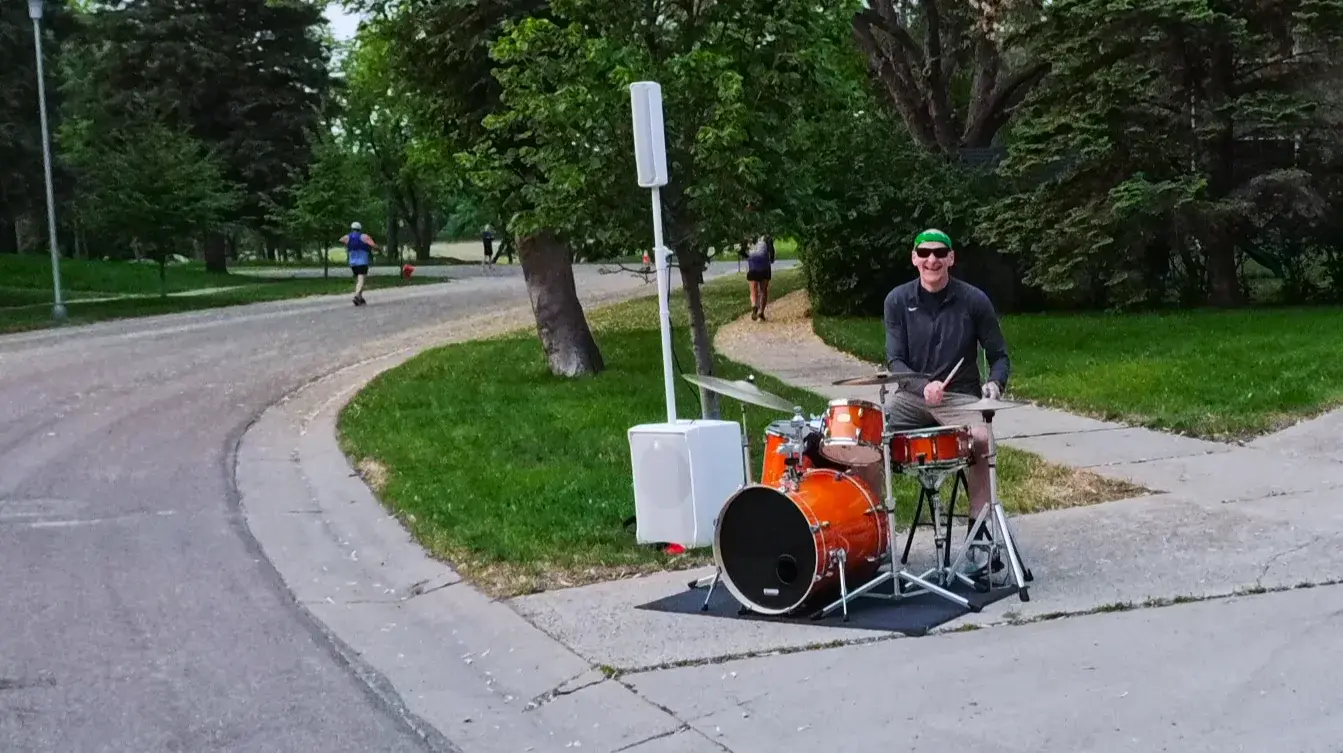 Drummer playing from the curb