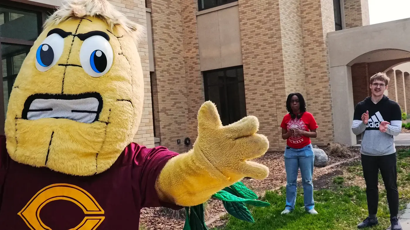 Cobber mascot reaching out