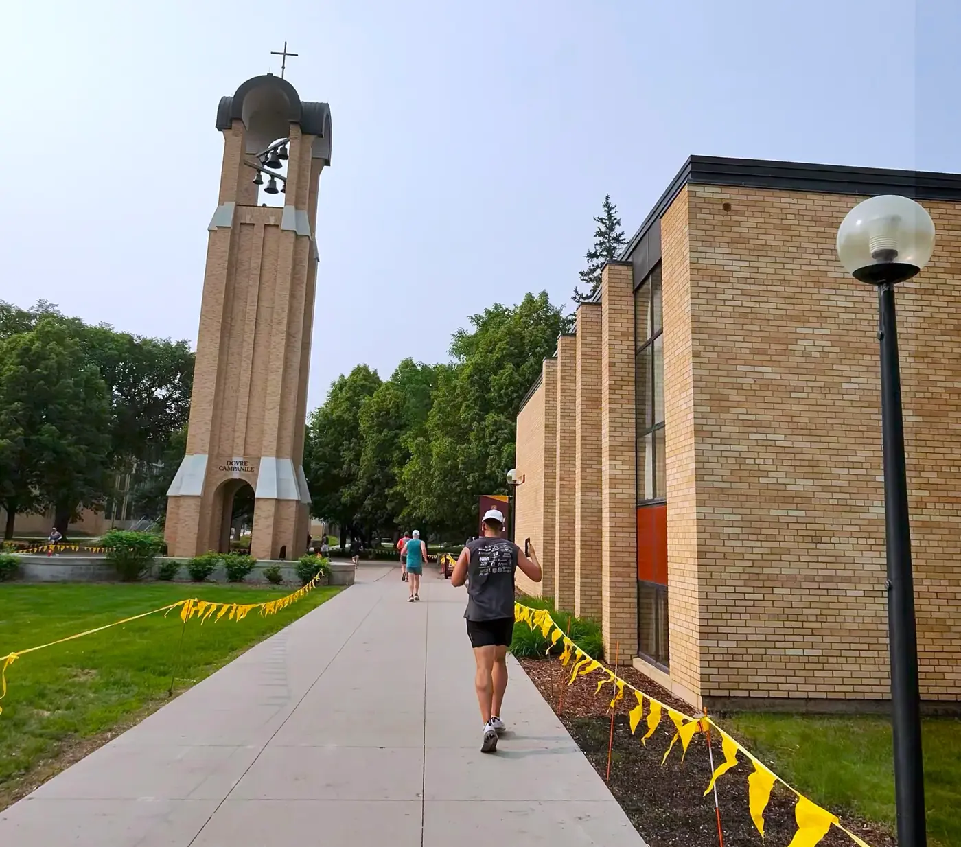Bell tower framed by yellow pennants