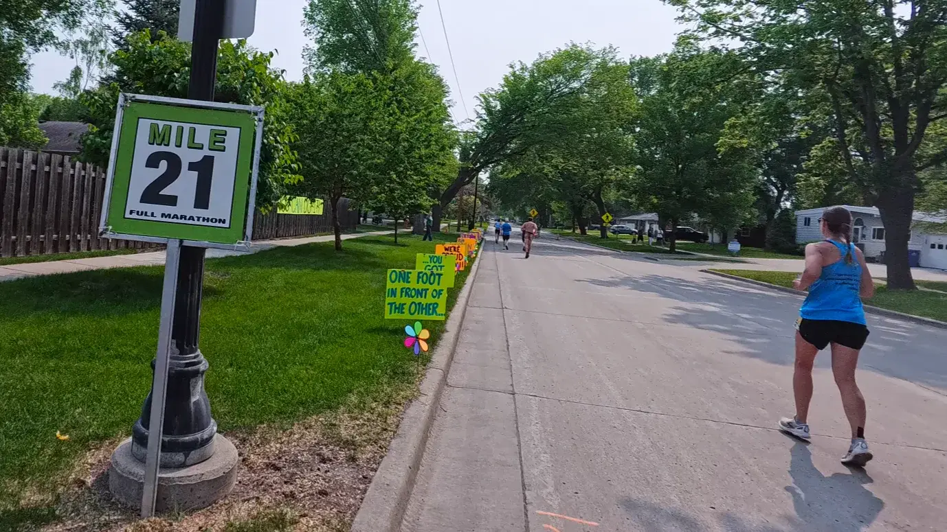 Mile 21 sign under the shade