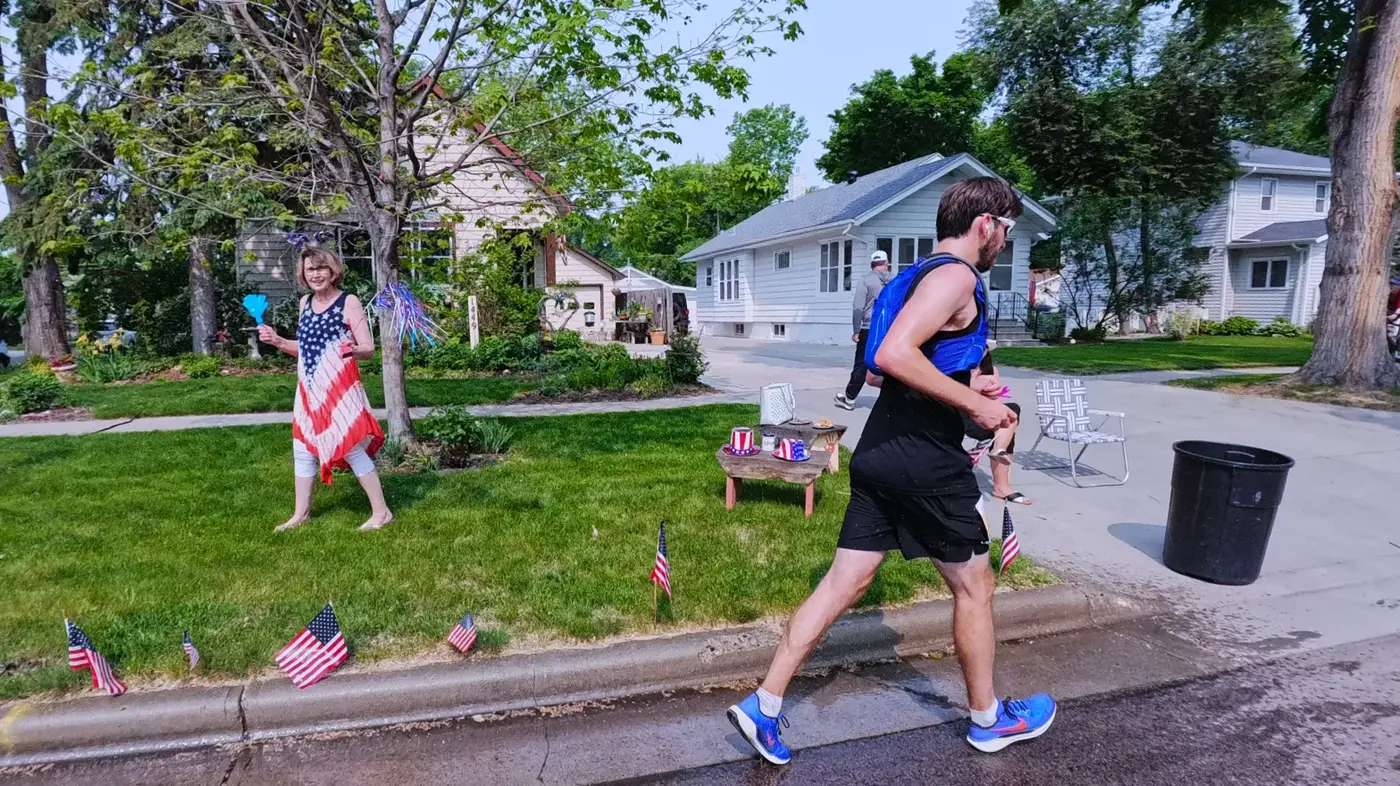 Pink tutu runner on the curb