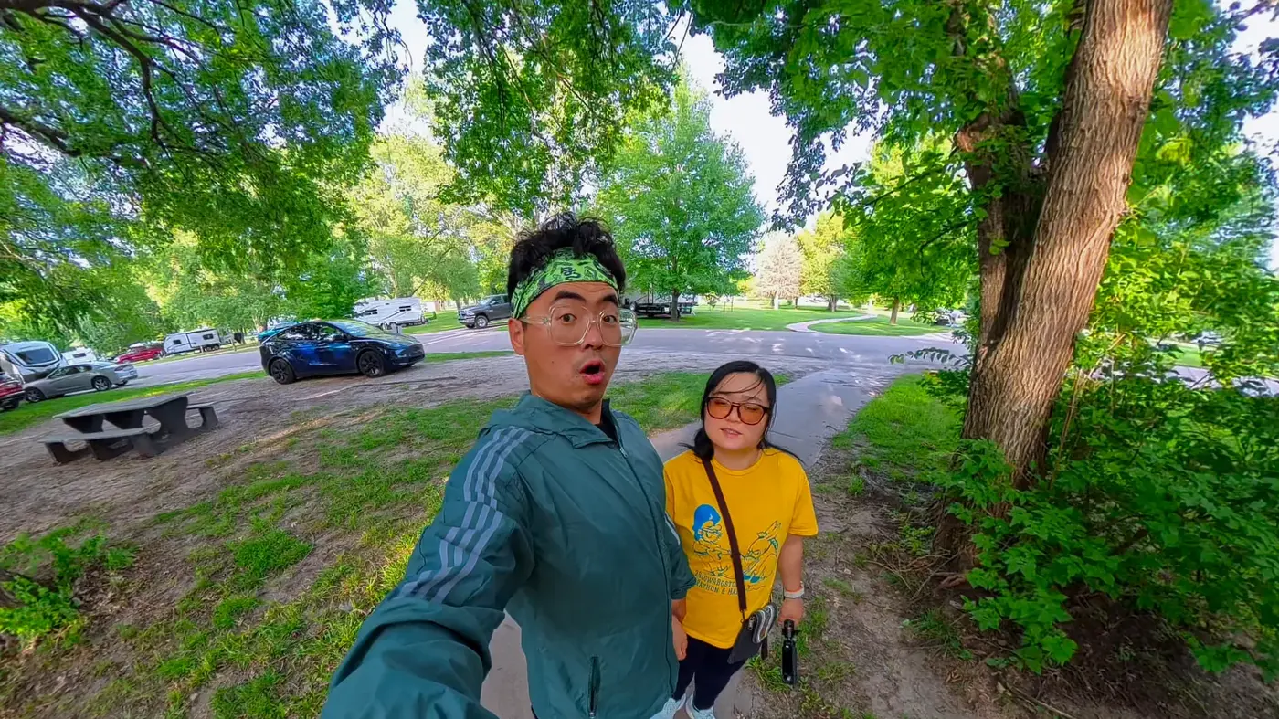 Two-person selfie under the trees