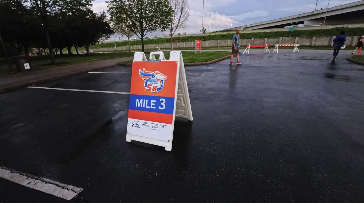 Mile 3 sign in the 5K rain