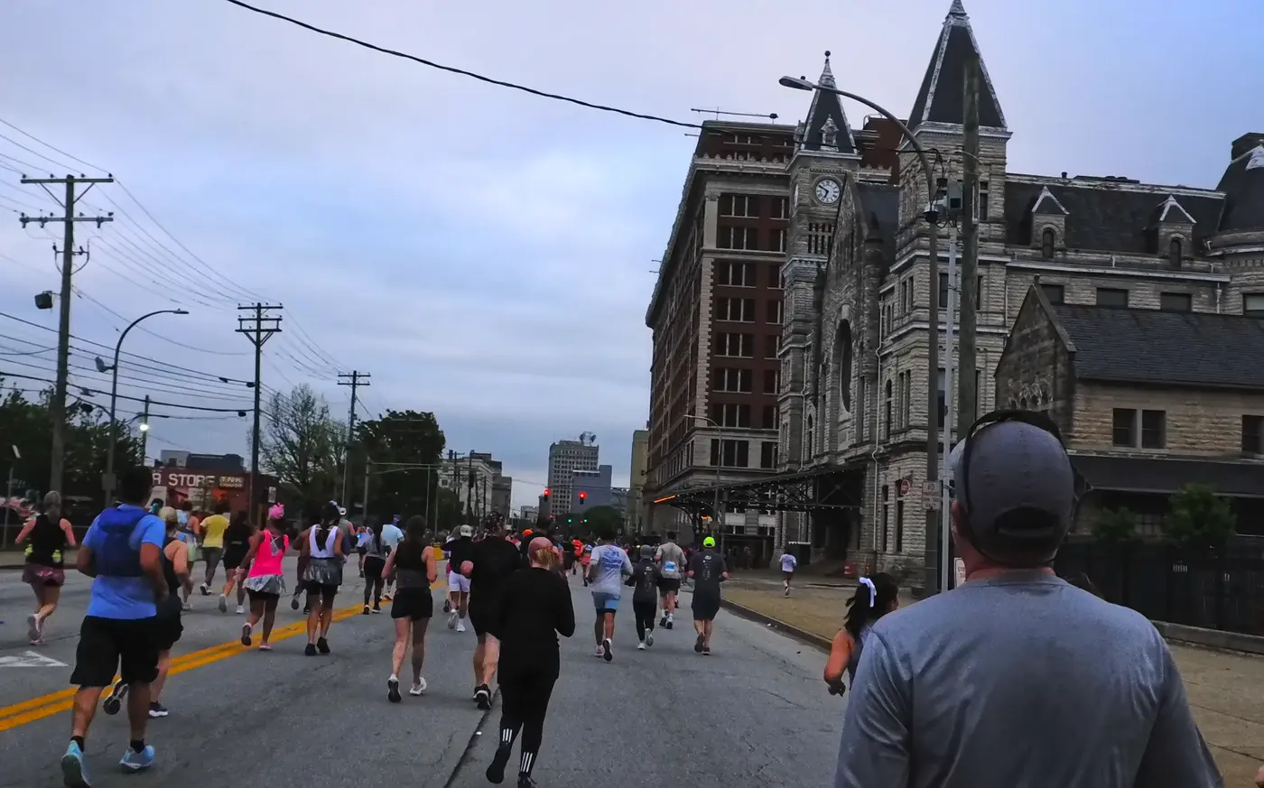 Runners passing a church near downtown