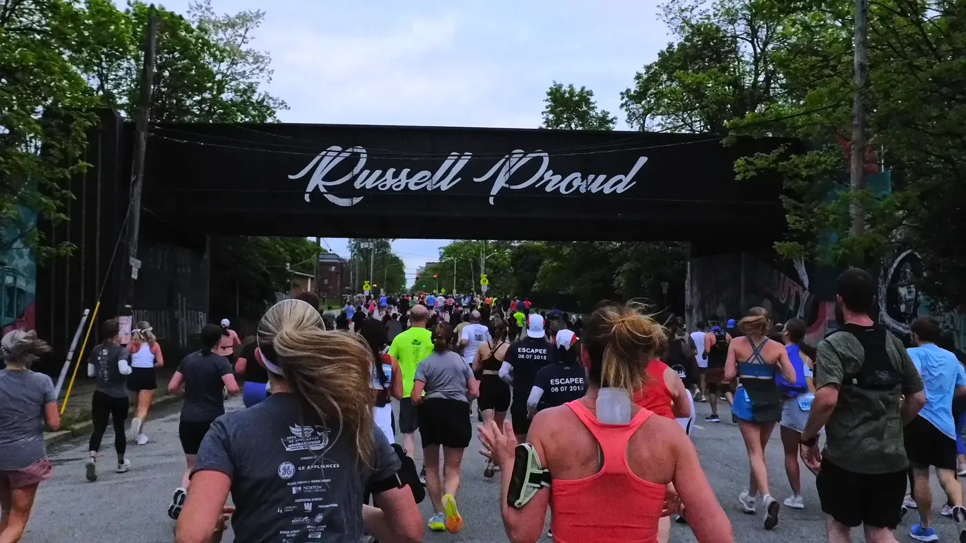 Russell Proud banner over the course