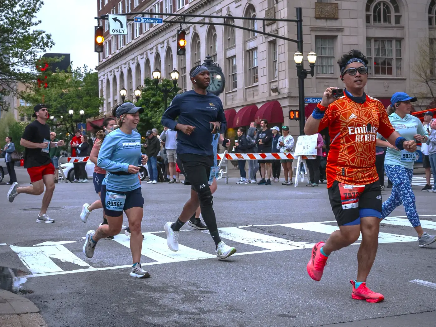 Runner crossing the downtown city crosswalk