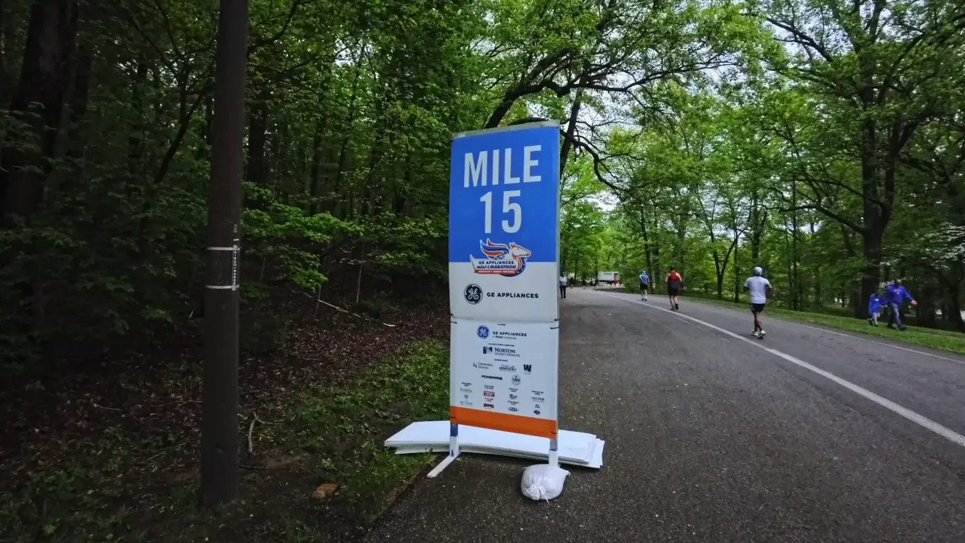 Mile 15 sign in the green section