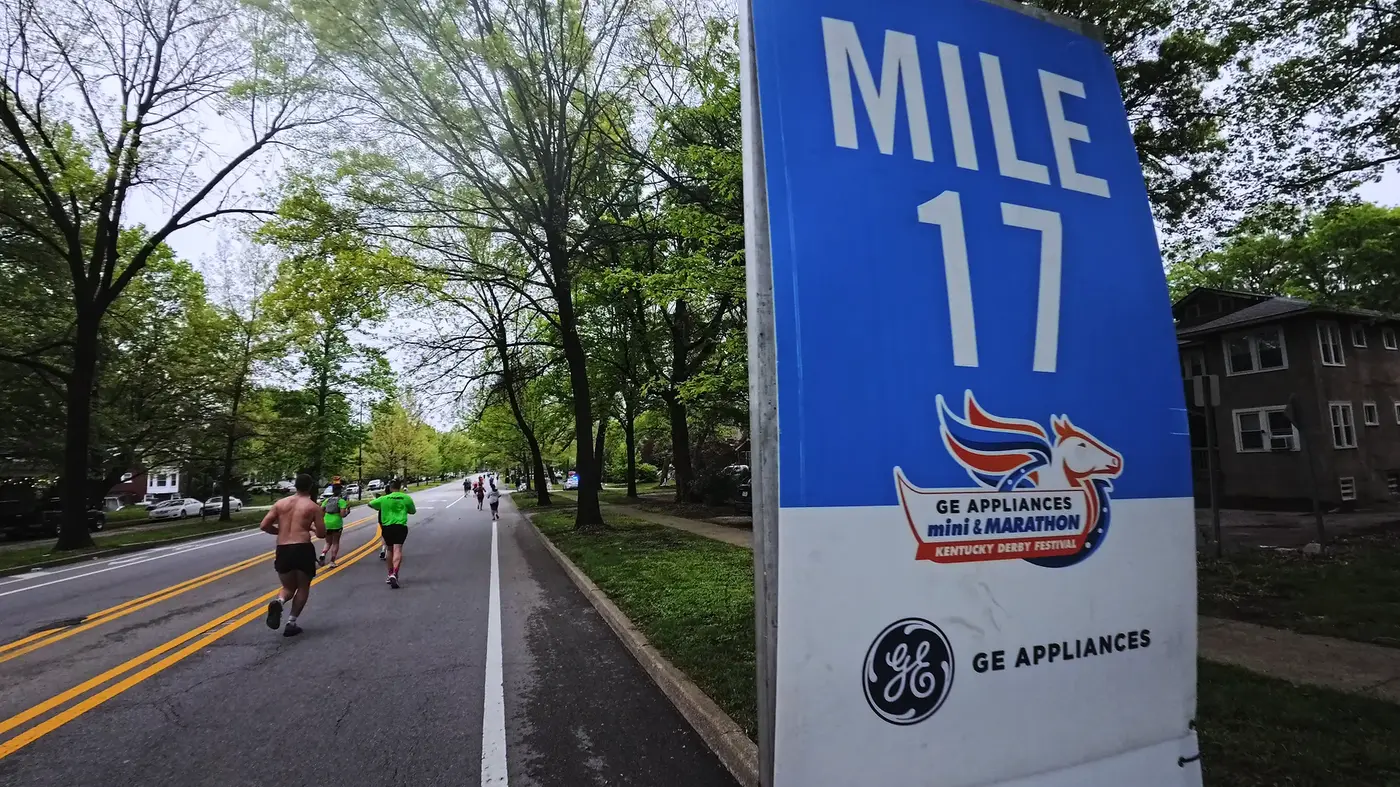 Mile 17 sign under tree shade