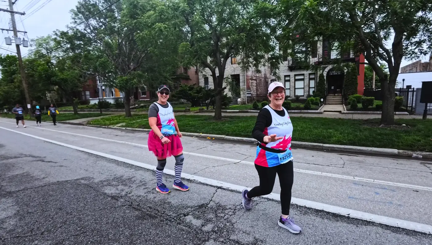 Runners in bright costumes near campus