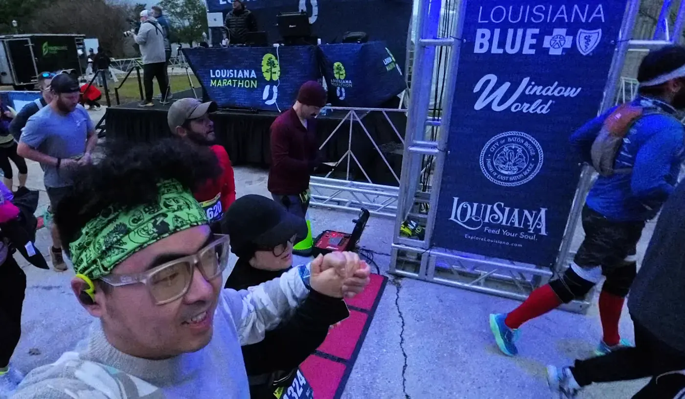 Selfie beside the Louisiana start banner
