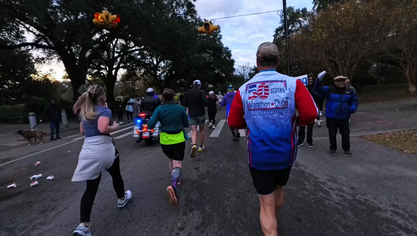 Runners turning through a residential street