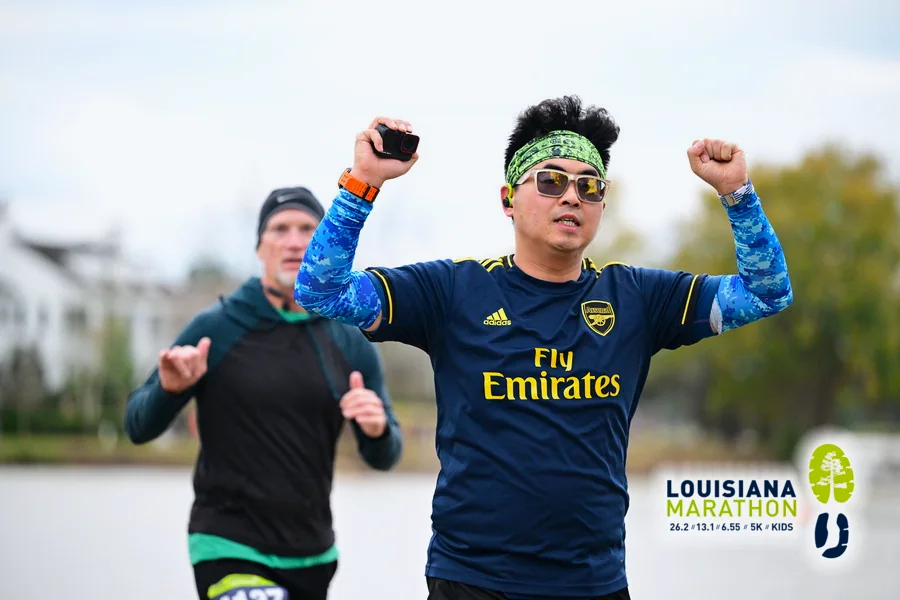 Official race photo with both arms up