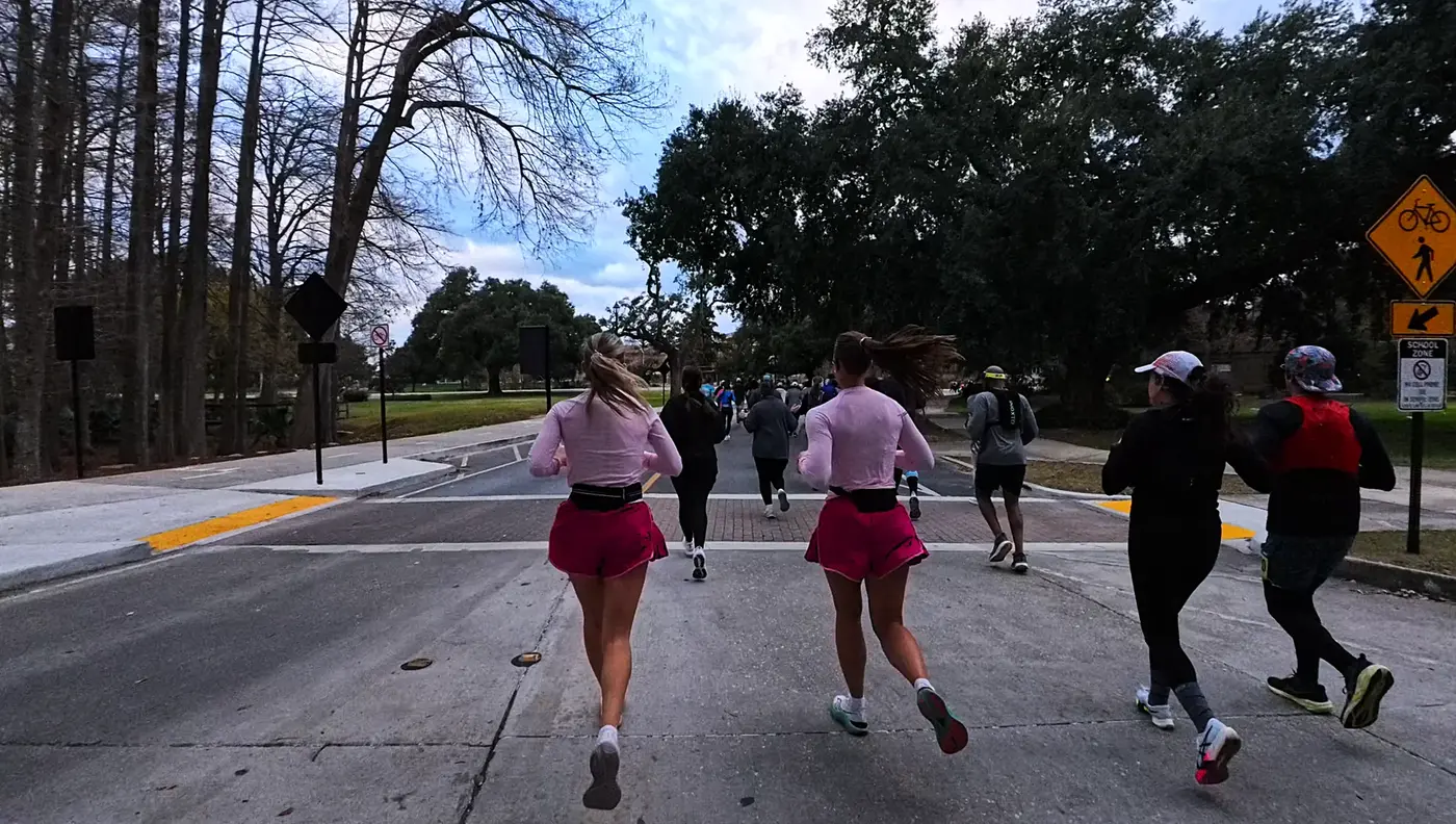Pacers and runners on a quiet road