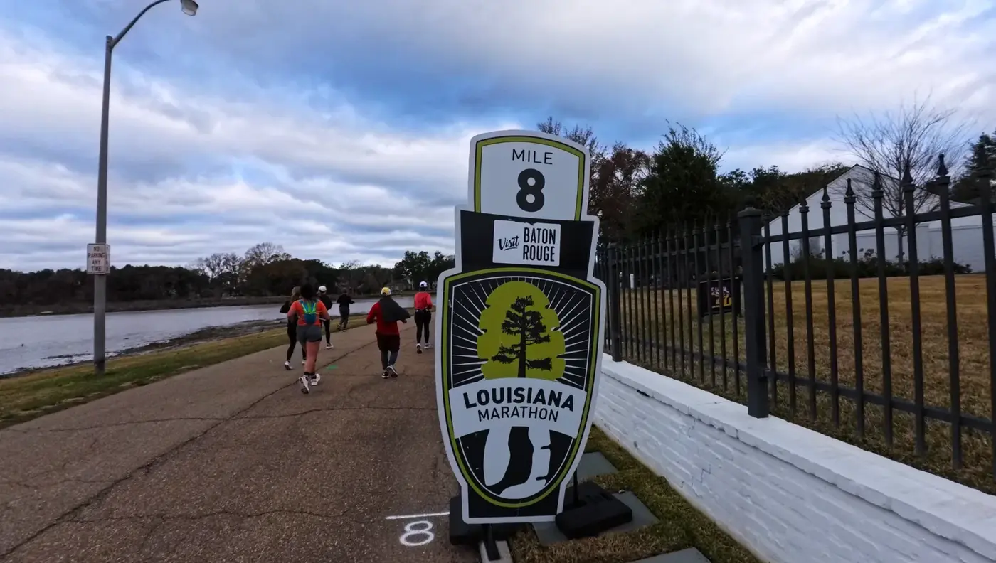 Mile 8 sign by the fence