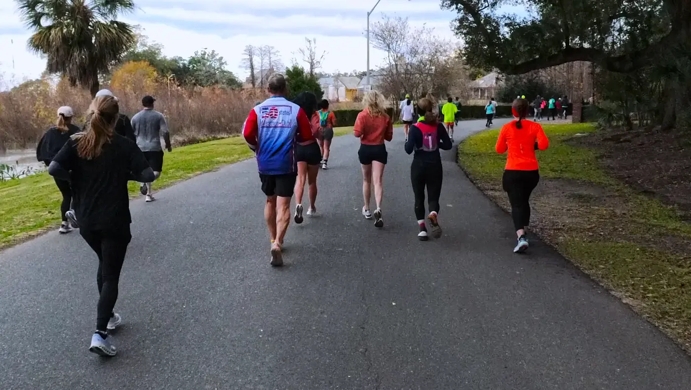 Long road with runners spread out