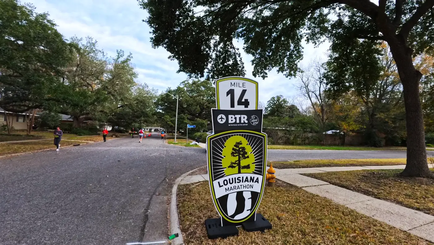Mile 14 sign on a quiet residential road