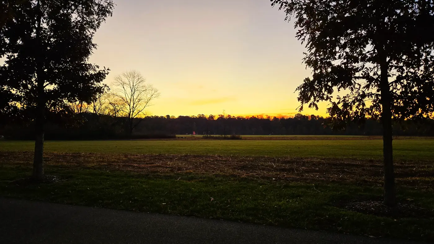 Race-morning sunrise turning the field and