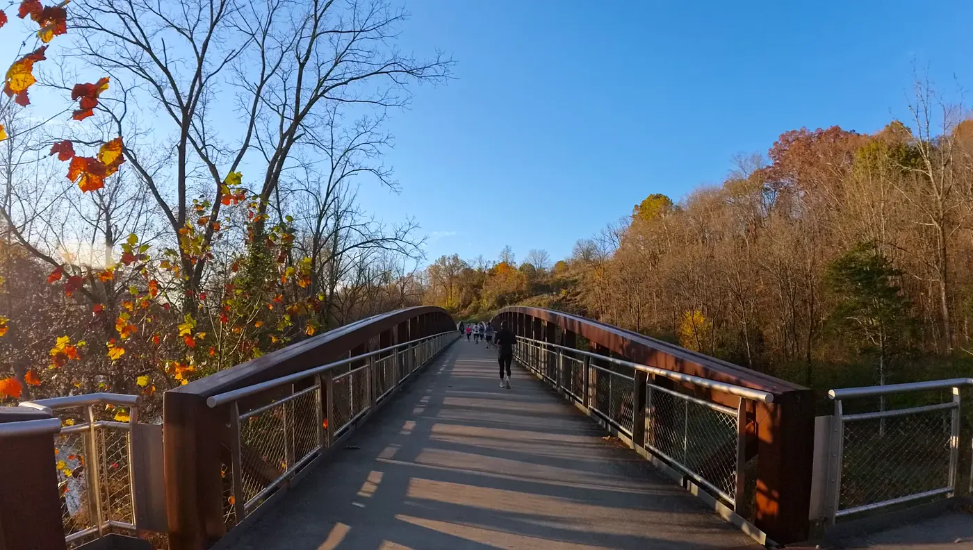 Crossing a park bridge on the course