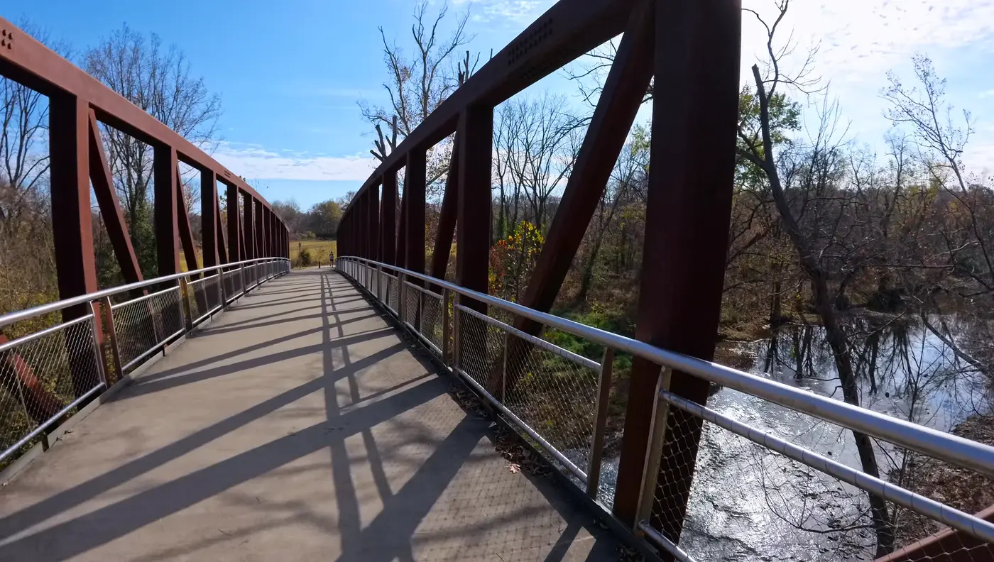 Back across the red iron bridge