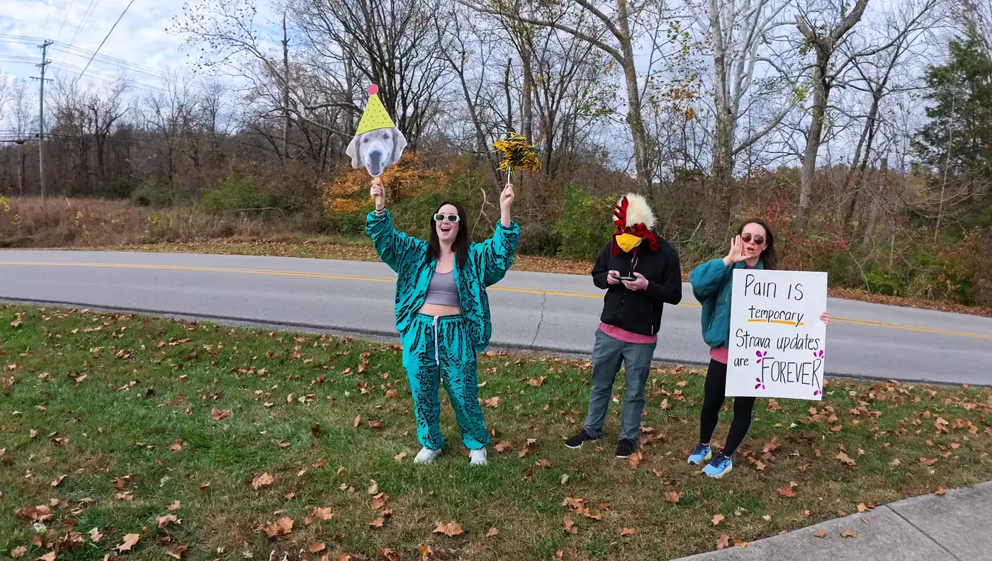 Spectators and signs cheering from the