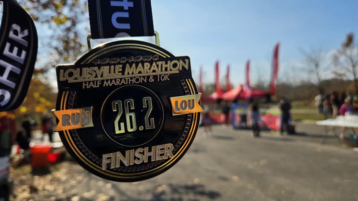 black-and-gold medal against the red race