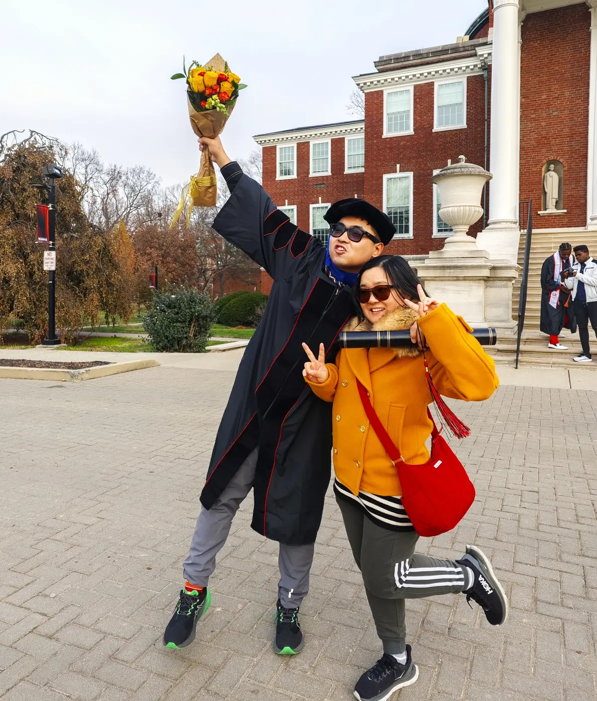 Lifting the doctoral flowers high on