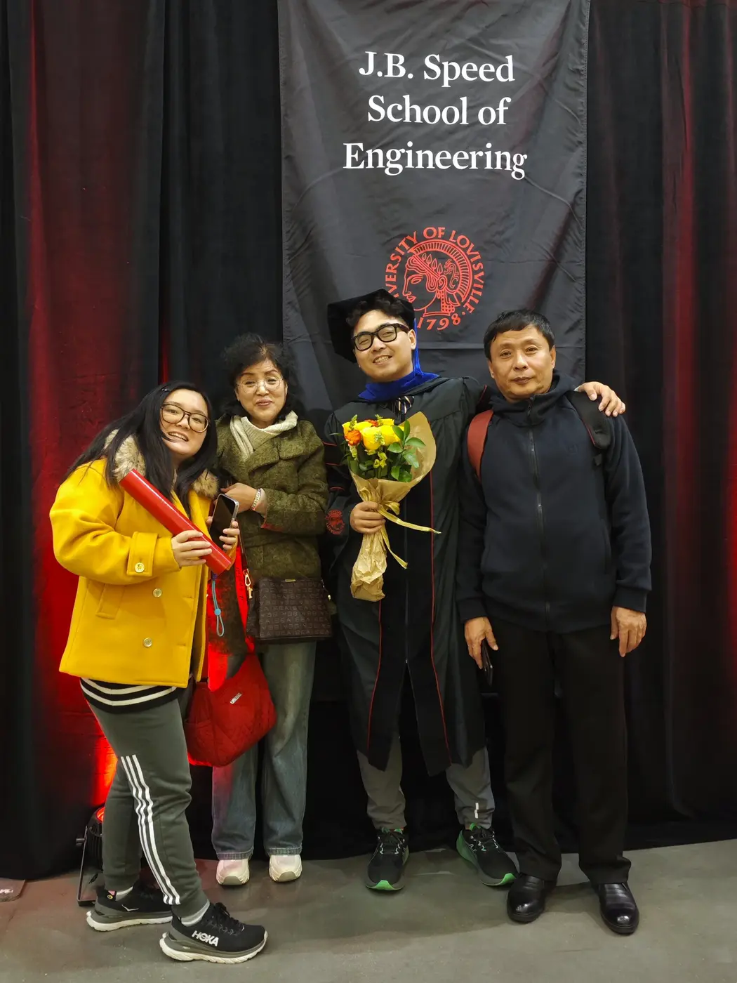 Family at the engineering school backdrop