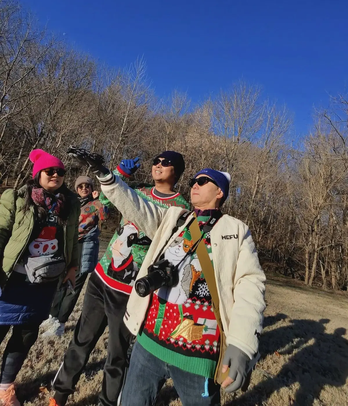 Walking in loud Christmas sweaters in
