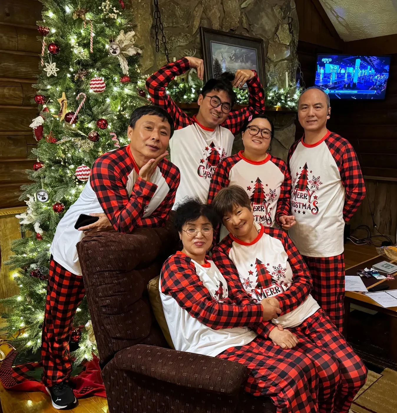 Matching pajama family photo by the cabin