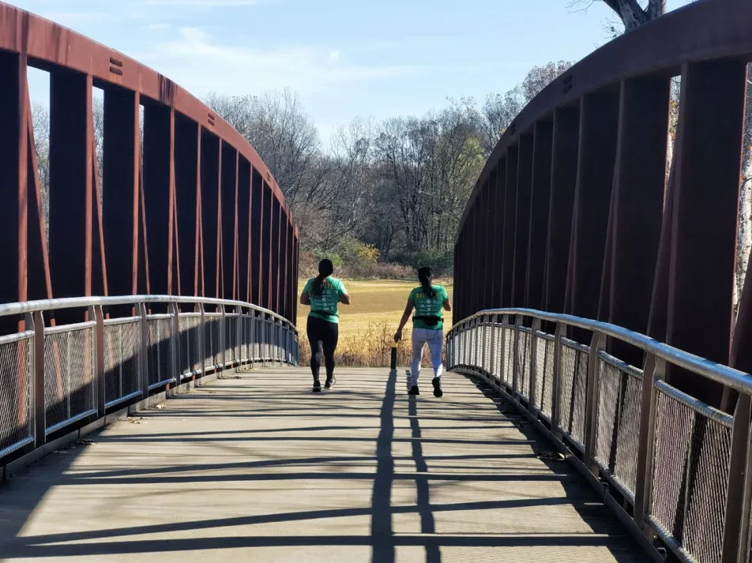 A runner in green and the iron bridge by Arsenan