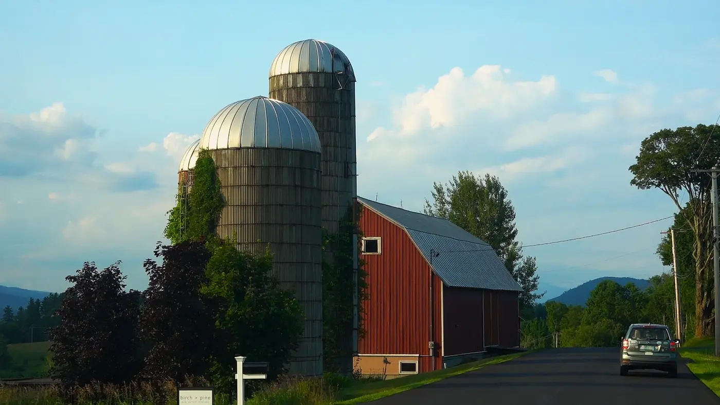 Red barn and twin silos in the valley