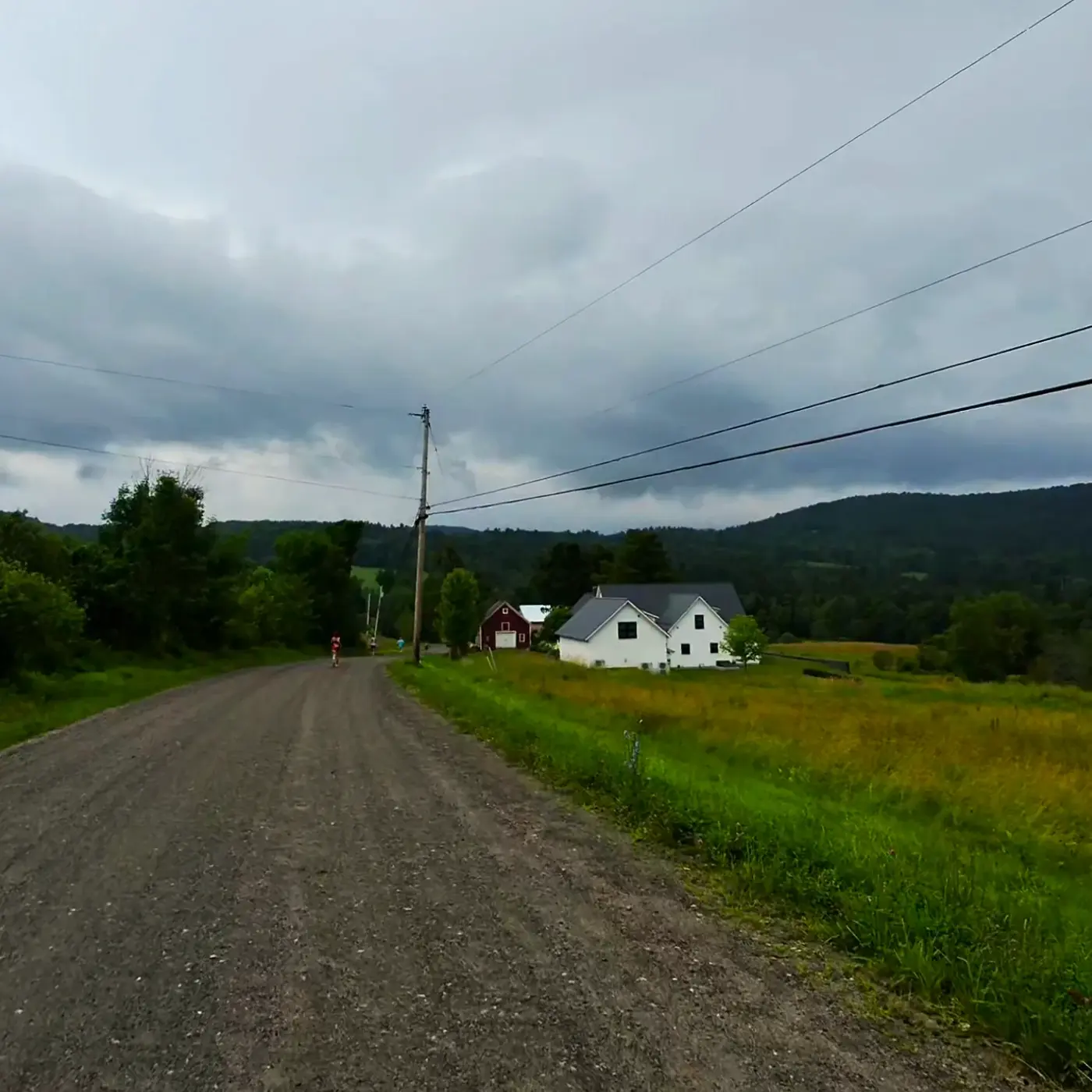 Dirt road beneath heavy clouds
