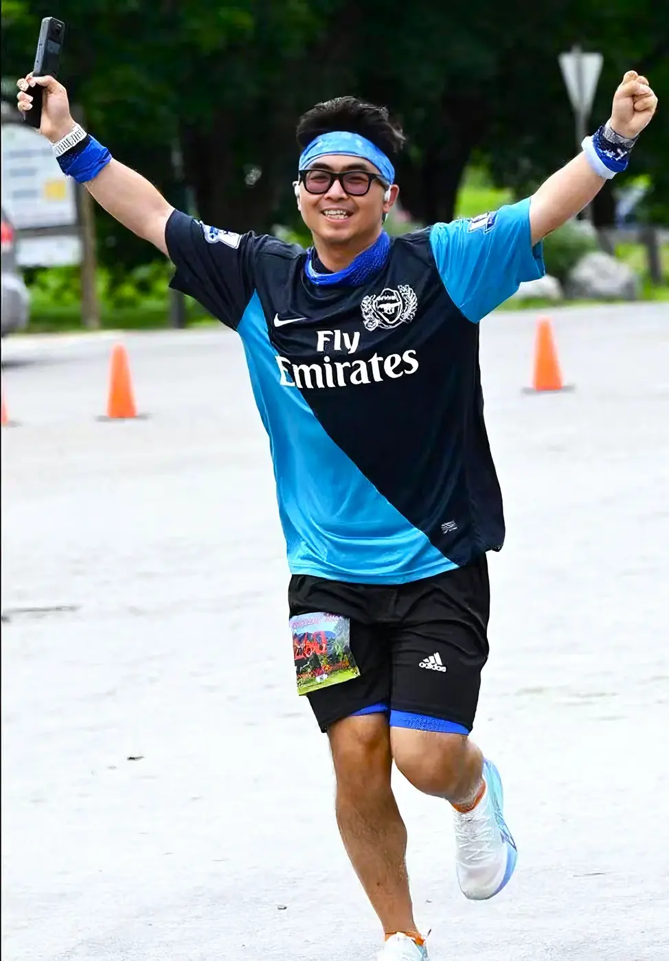 Official finish photo with arms raised