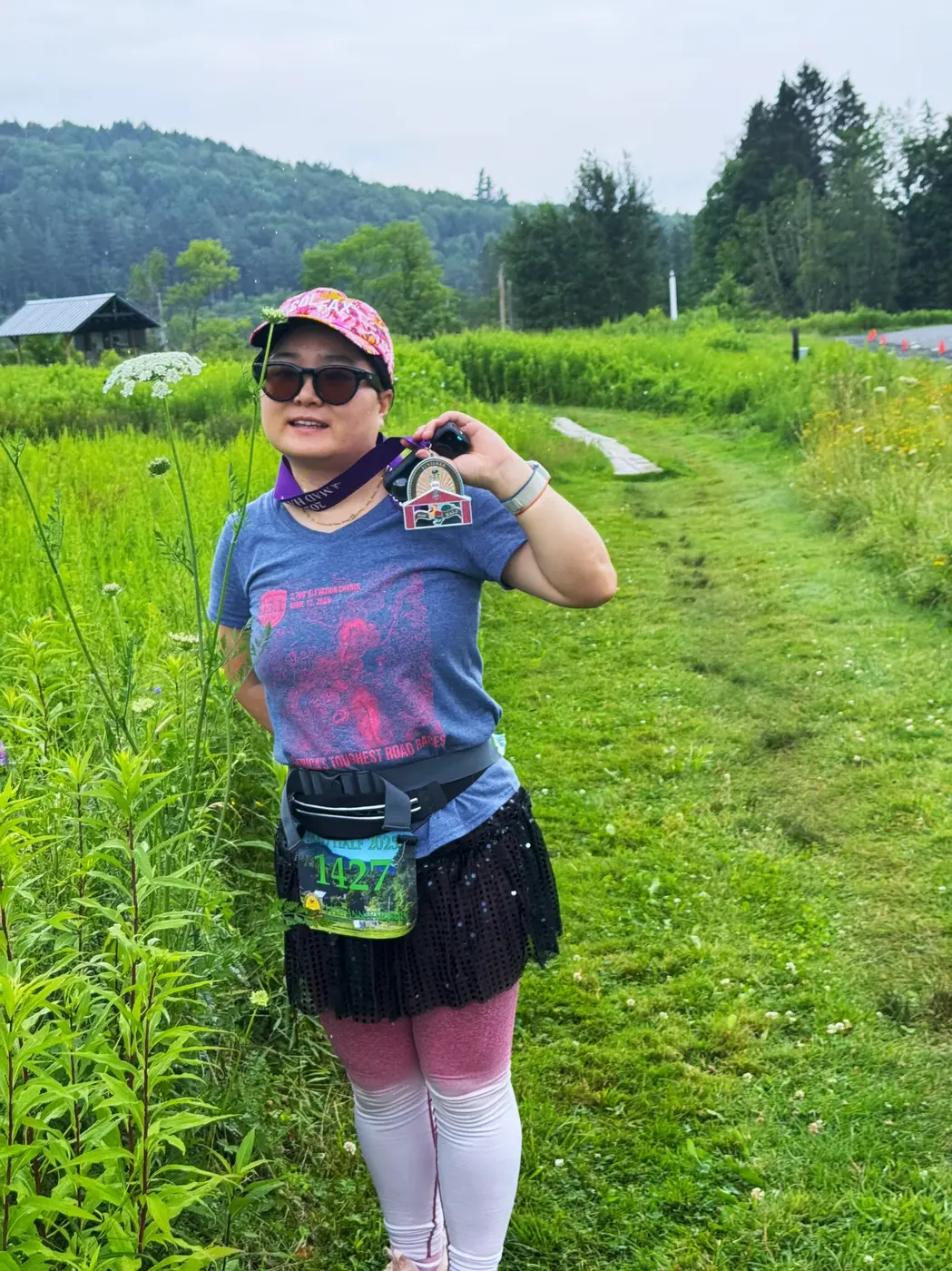 Siqi with the medal in the meadow