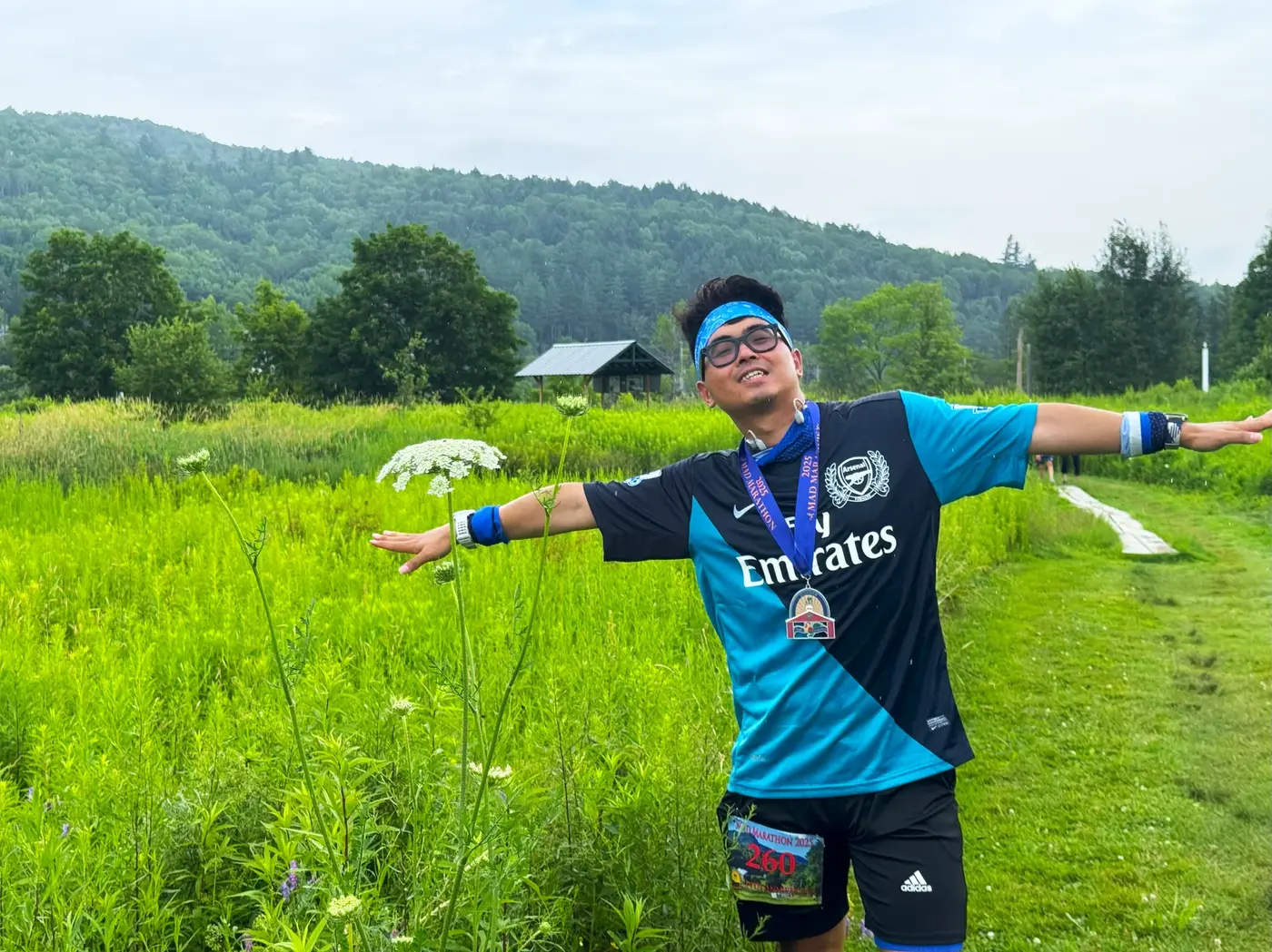Medal pose in tall summer grass