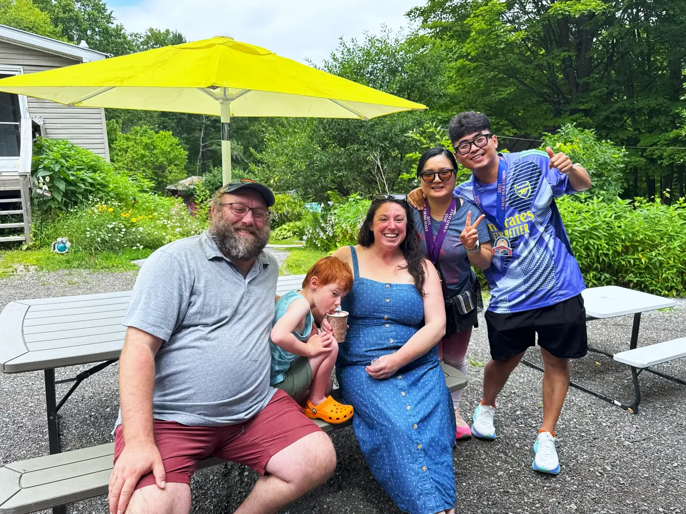 Family photo under the yellow umbrella