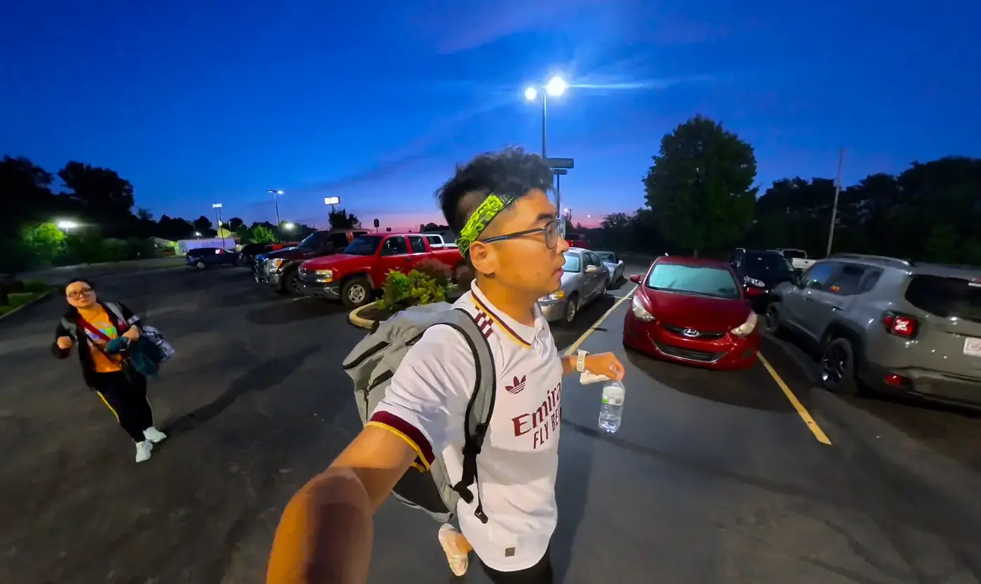 Race-morning parking lot under lights