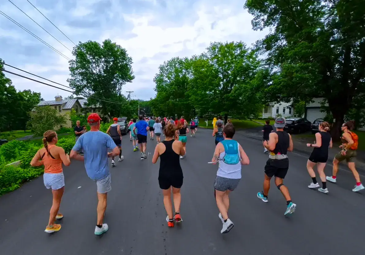Runners leaving the village street