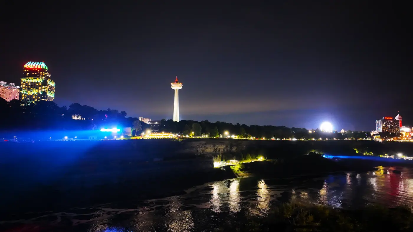 Niagara River glowing blue below the night