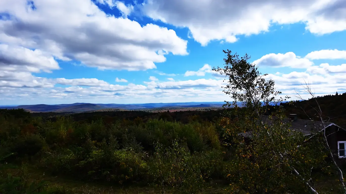 Layered Vermont hills under a bright